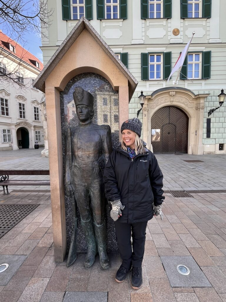 In front of statue in Bratislava