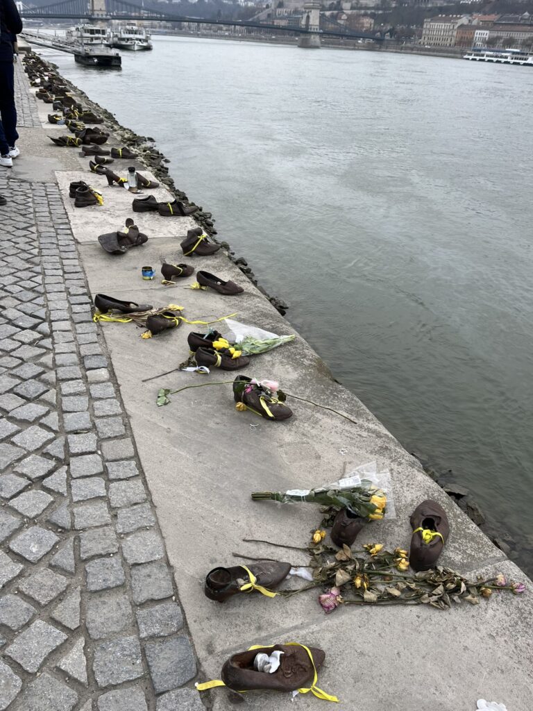 Bronze shoes along river