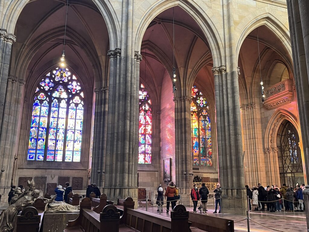 Stained glass windows in St Vitus Cathedral with the beautiful light coming in.