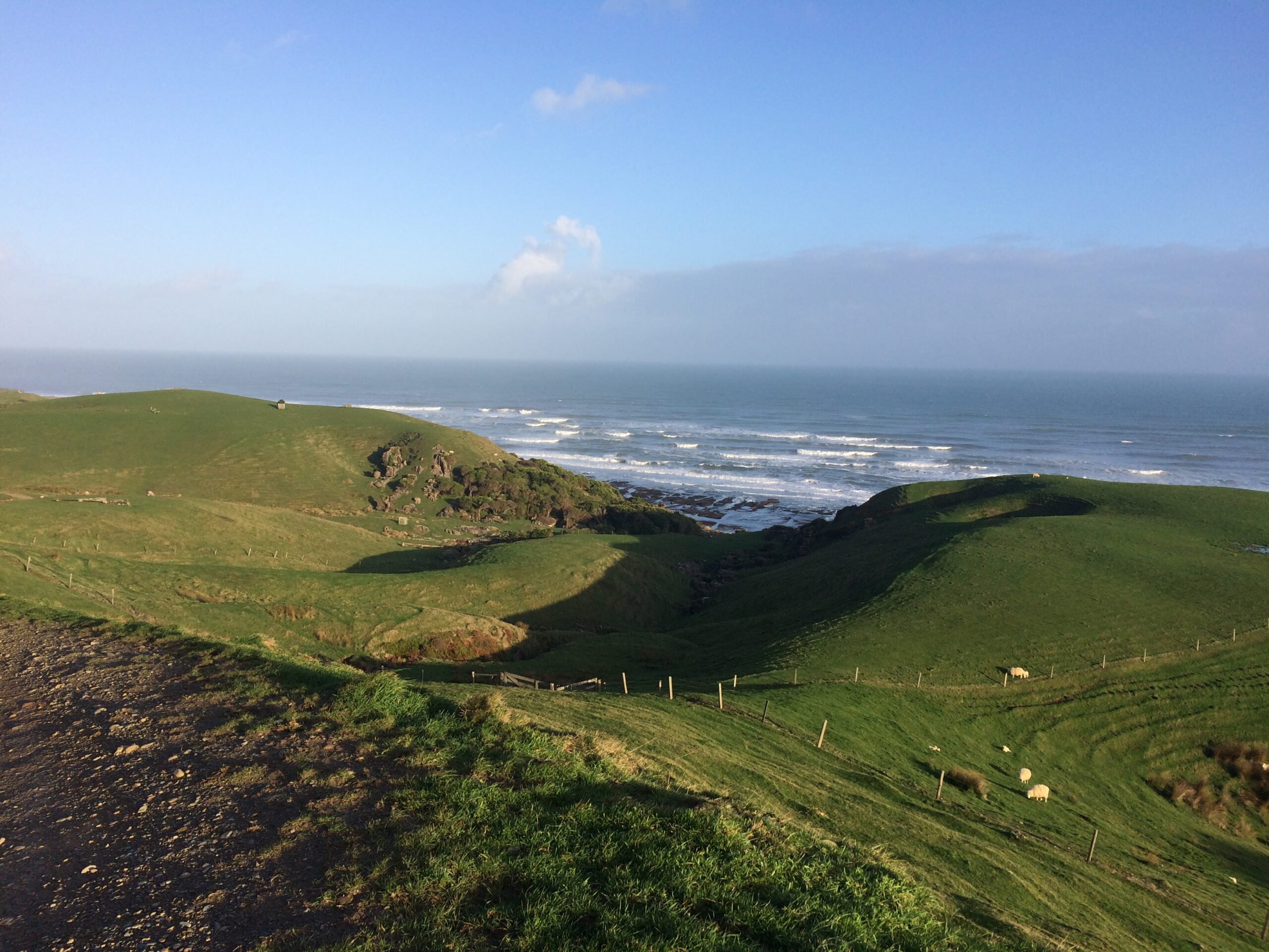 rolling green hills and the water