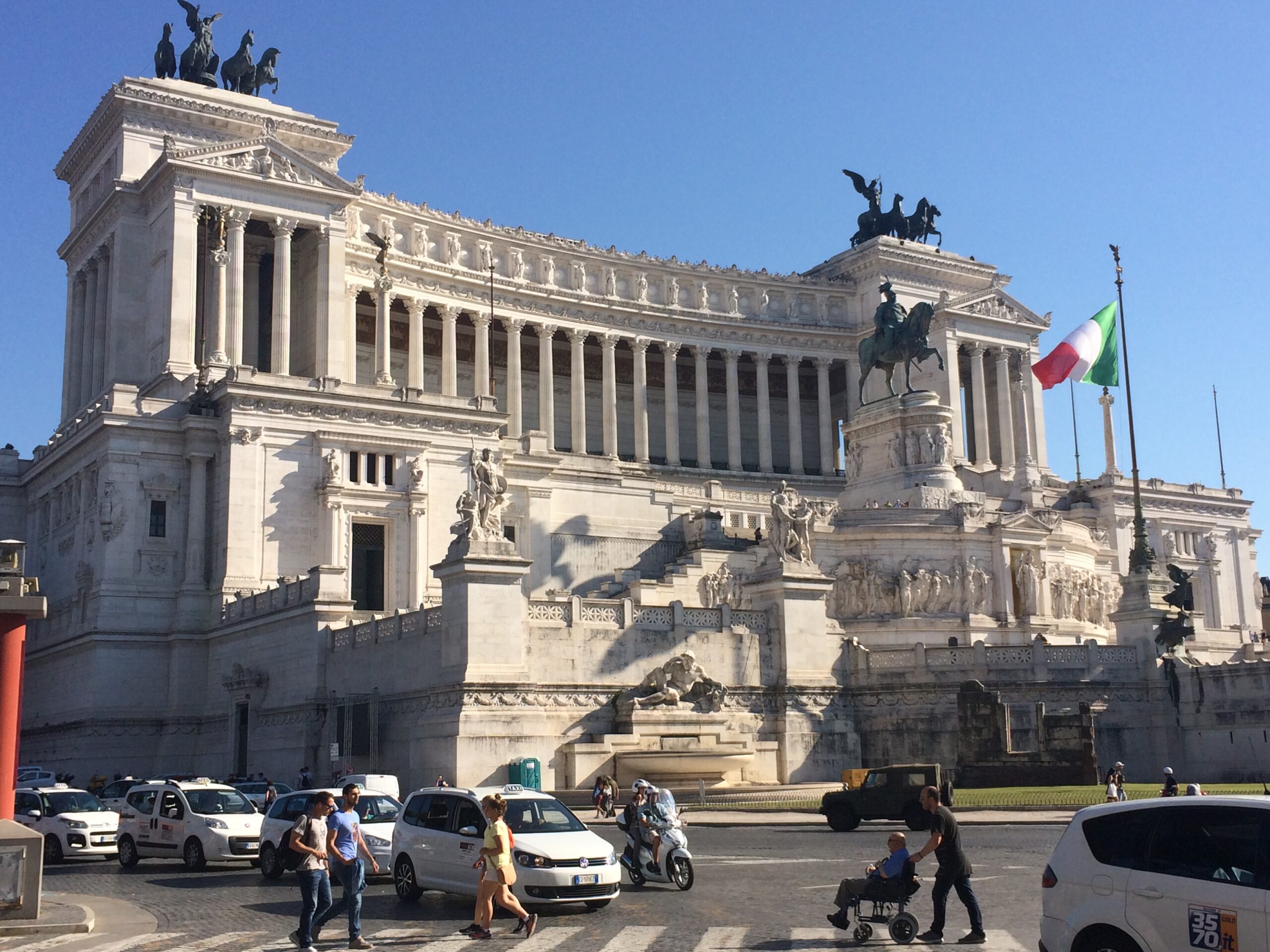 Building that looks like a wedding cake in Rome with Italian flag