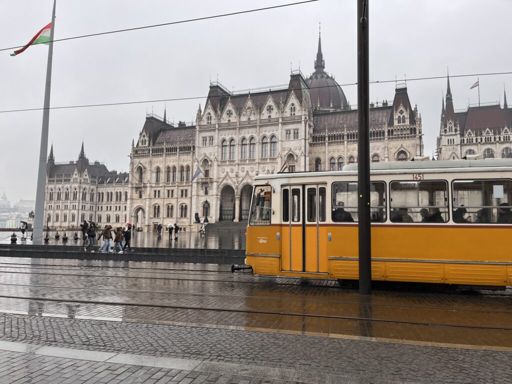 tram in front of parliament budapest