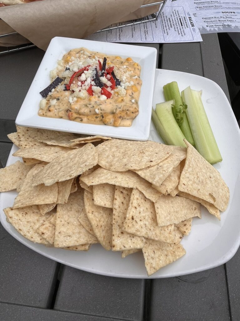 Corn dip and chips with celery