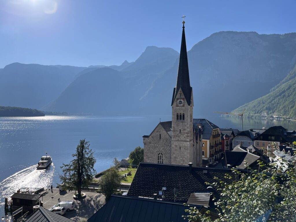 Hallstatt views showing boat, mountains and church