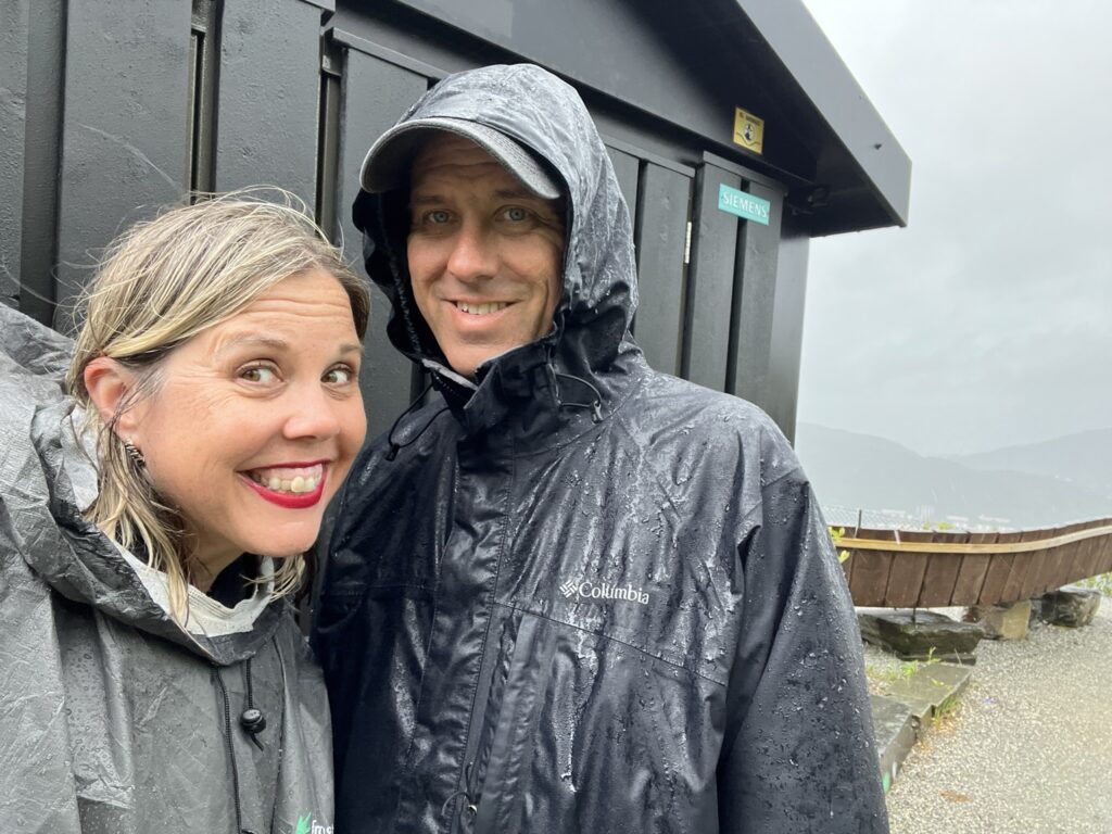 two people in the rain. very wet