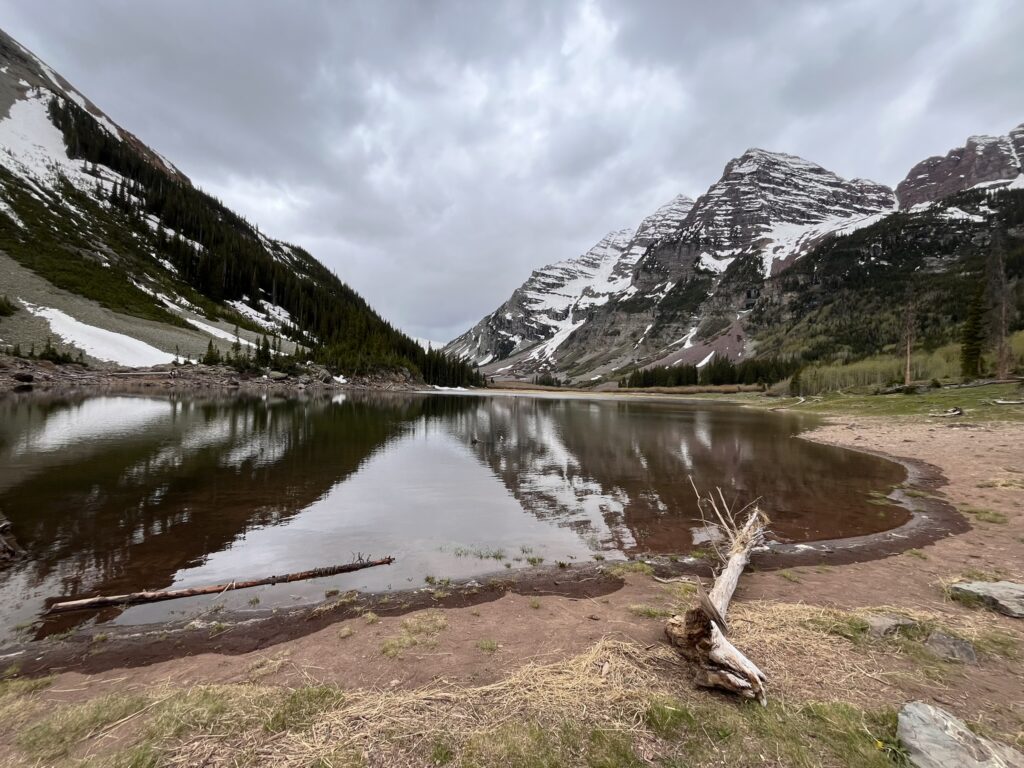 A lake with snowcapped mountains