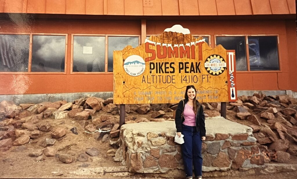 In front of pikes peak sign