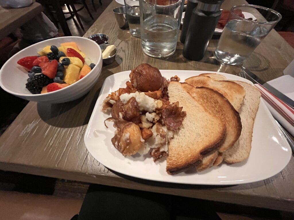 Breakfast at Hotel Vintage including fruit, toast and potatos
