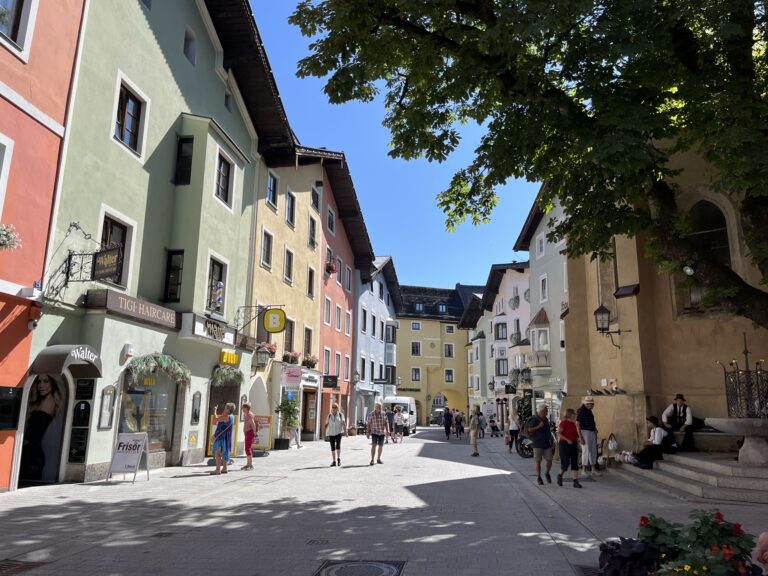 Kitzbuhel street with shops and colorful buildings